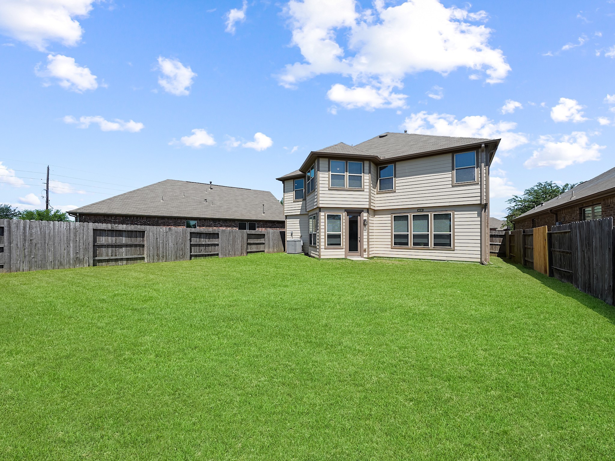 24131 Adobe Ridge Lane Katy, TX 77493 - Photo 37 of 37 a backyard of a house with lots of green space