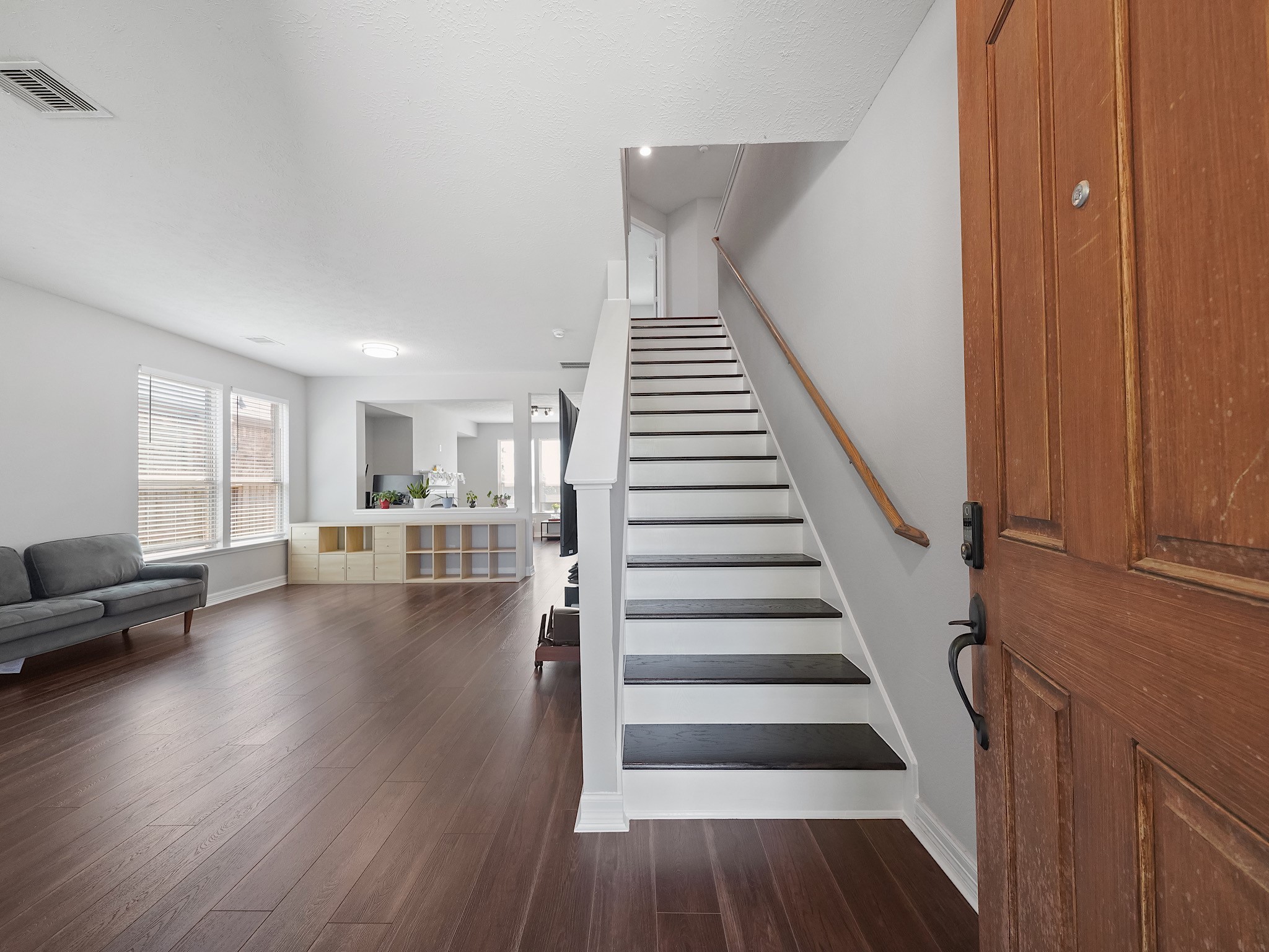 24131 Adobe Ridge Lane Katy, TX 77493 - Photo 4 of 37 a view of entryway and hall with wooden floor