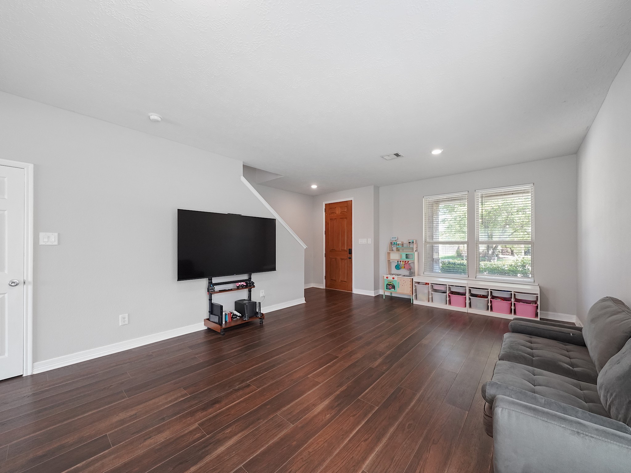 24131 Adobe Ridge Lane Katy, TX 77493 - Photo 6 of 37 a living room with furniture and a flat screen tv