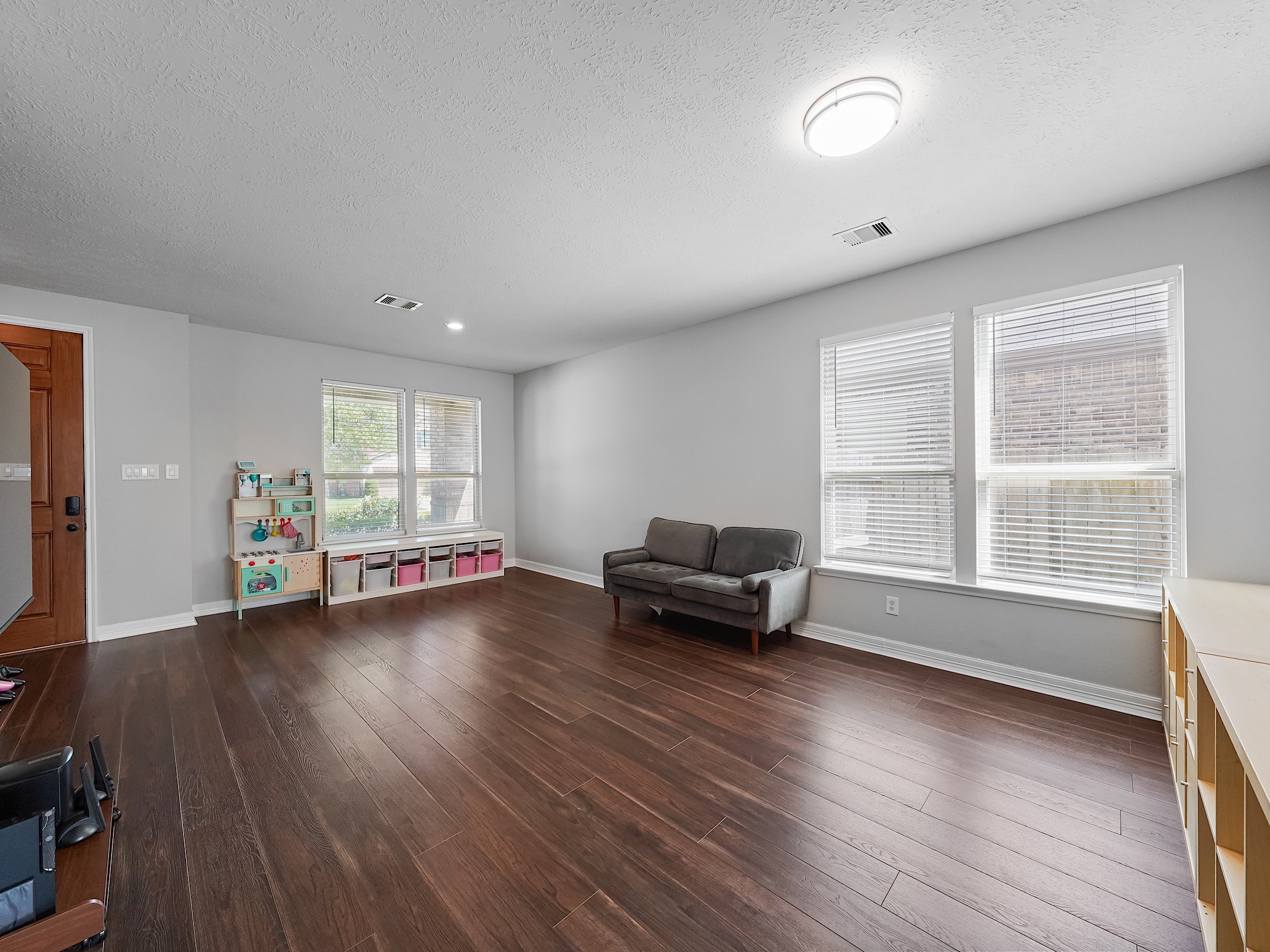 24131 Adobe Ridge Lane Katy, TX 77493 - Photo 7 of 37 a living room with furniture and a wooden floor
