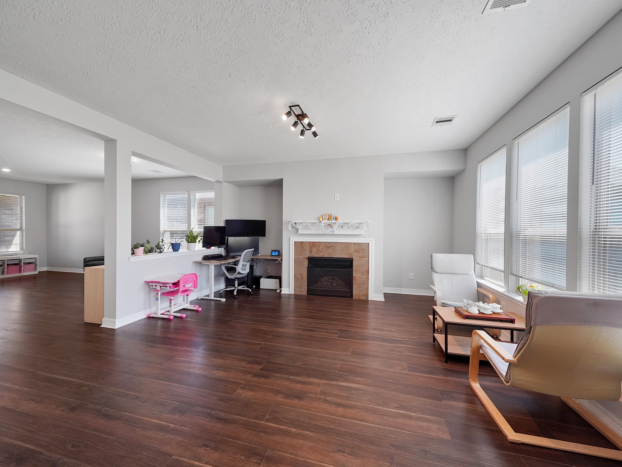 24131 Adobe Ridge Lane Katy, TX 77493 - Photo 9 of 37 a living room with furniture and a fireplace