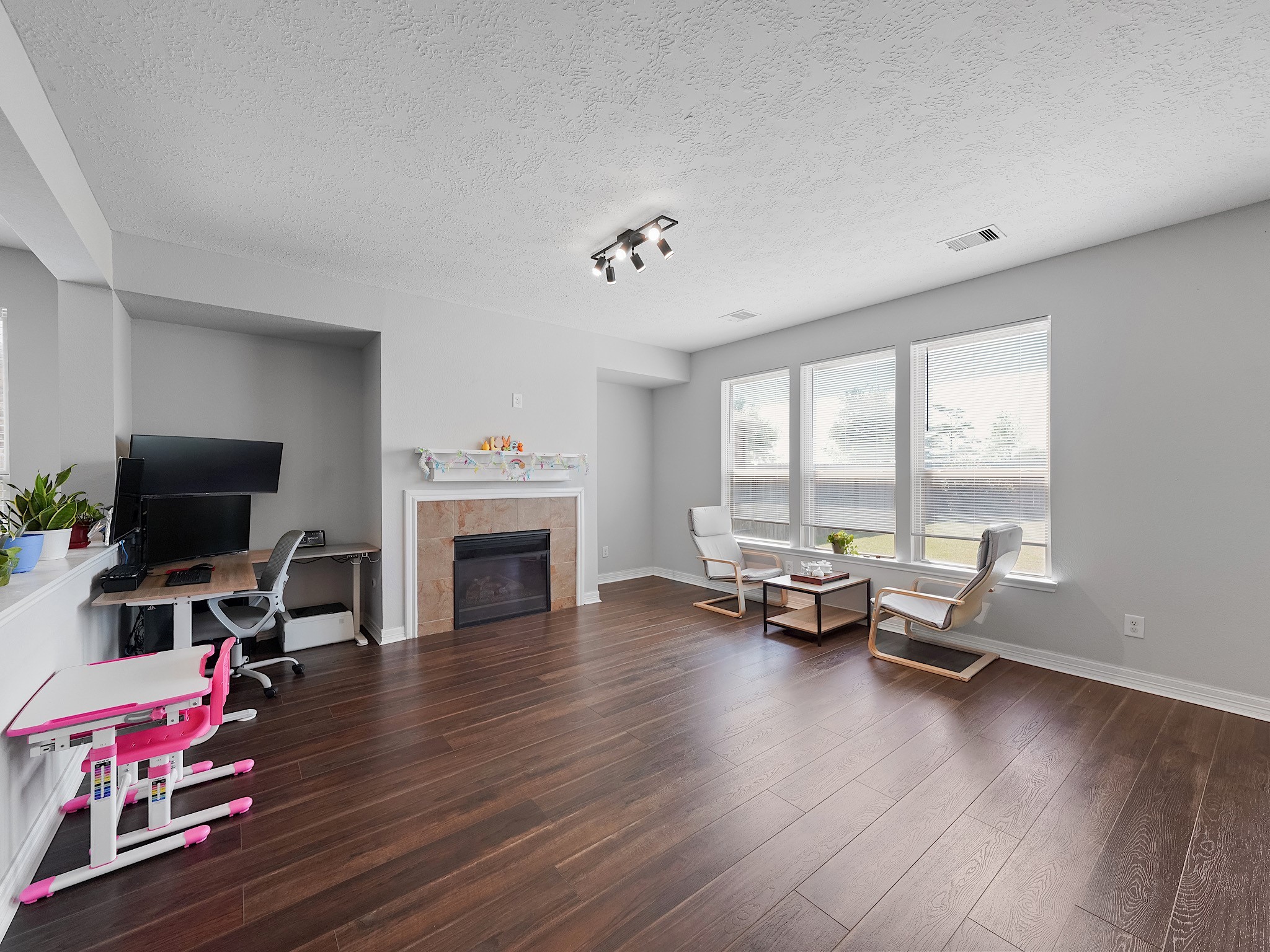 24131 Adobe Ridge Lane Katy, TX 77493 - Photo 10 of 37 a living room with furniture and a fireplace