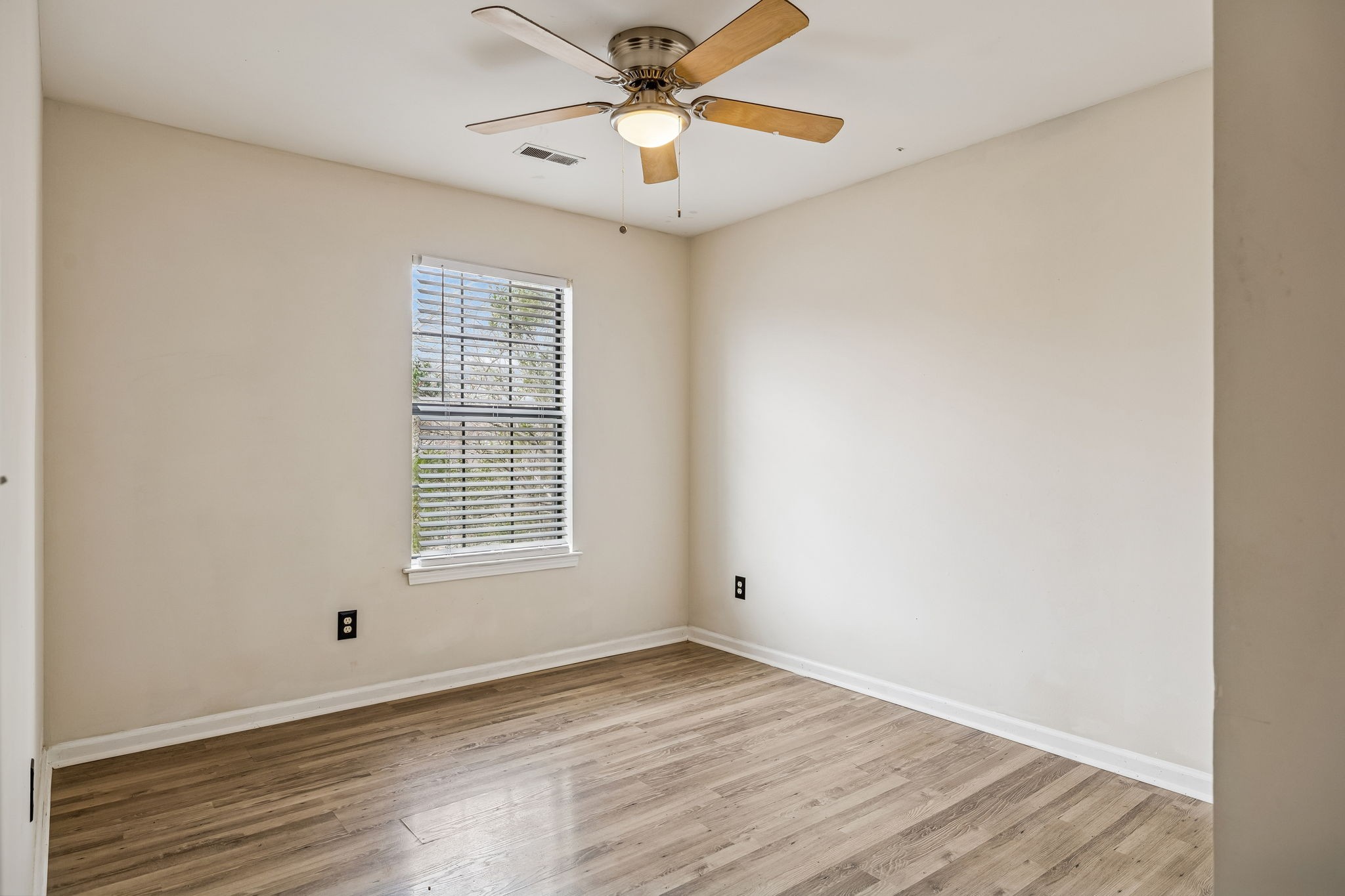 7701 Poplar Ridge Drive Nashville, TN 37221 - Photo 20 of 28 a view of empty room with wooden floor and fan