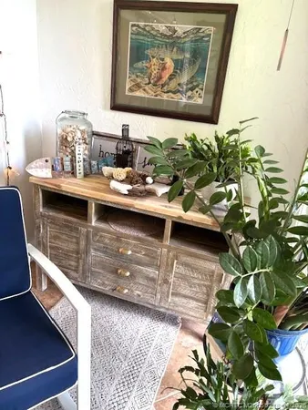 an aerial view of a house with a garden and lake view