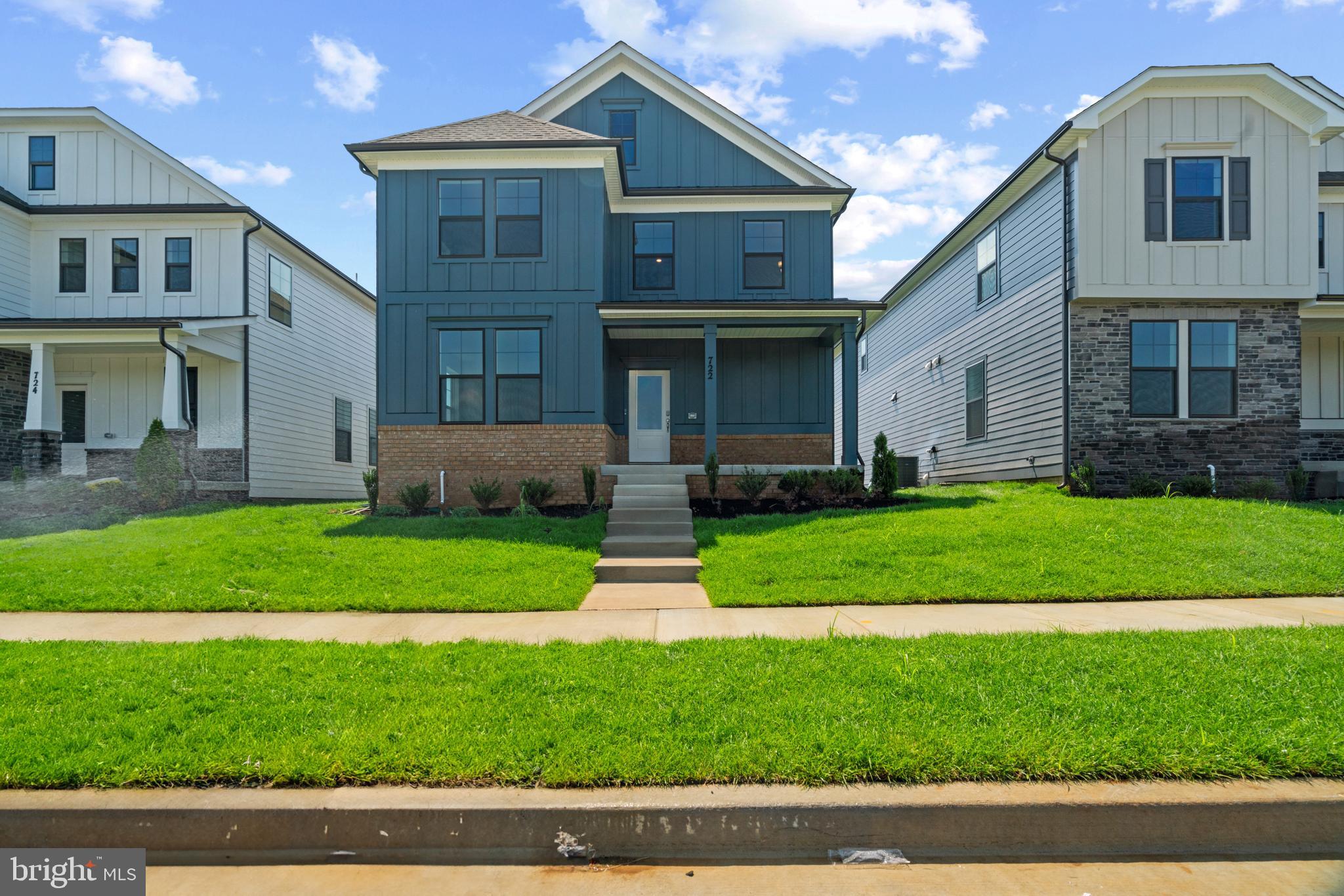 469 Hanson Street Frederick, MD 21701 - Photo 2 of 16 a front view of a house with a yard