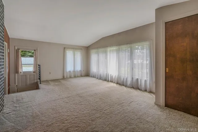 a view of an empty room and window