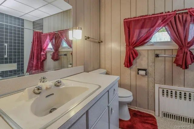 a view of empty room with a fireplace