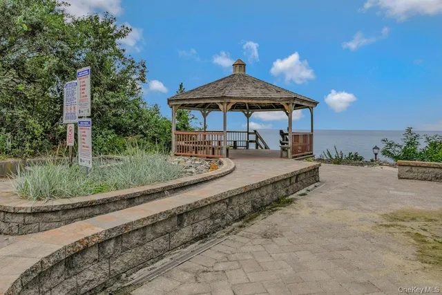 a view of a wooden deck with a lake