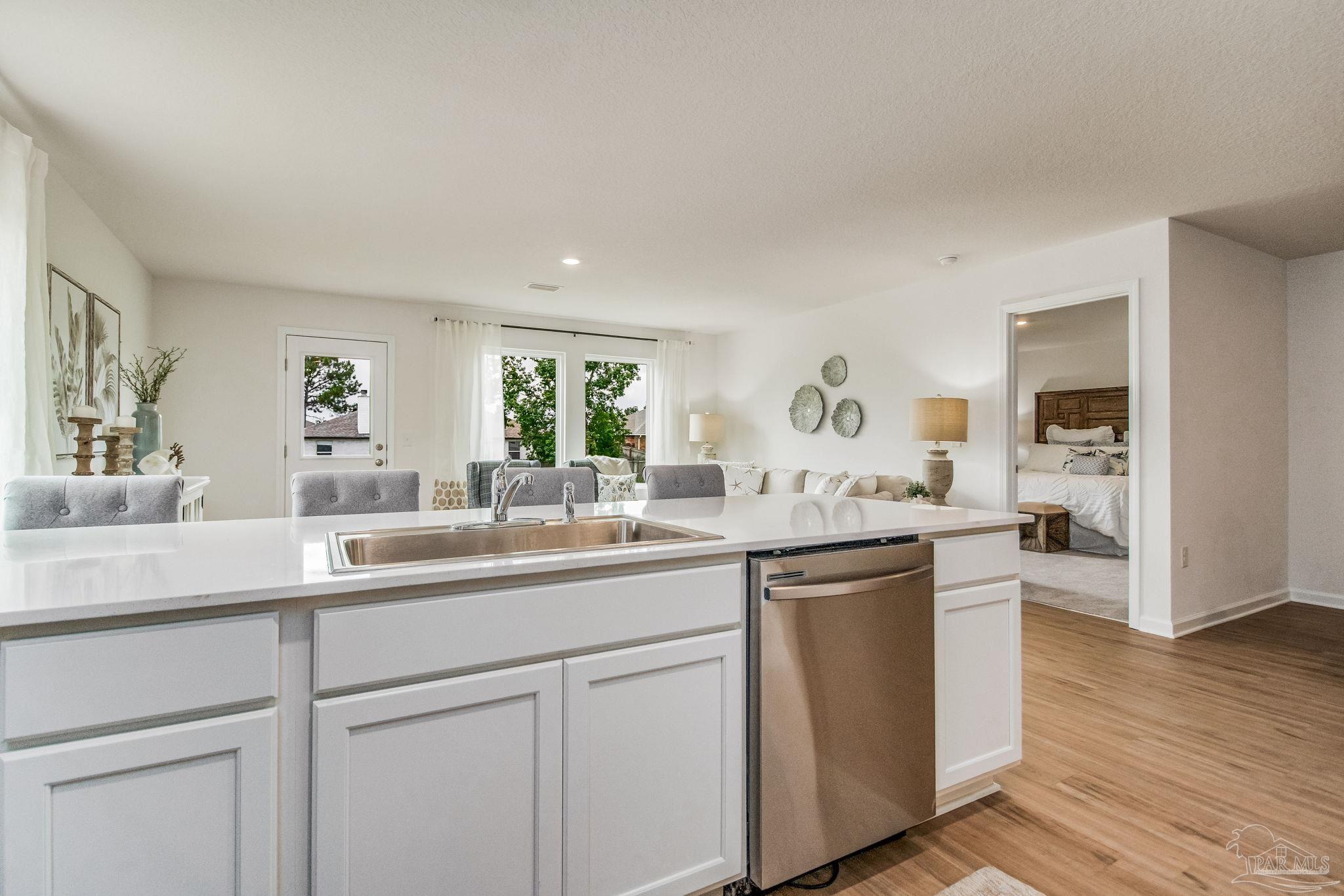 4745 Eagles Rdg Road Pace, FL 32571 - Photo 5 of 27 a kitchen with white cabinets and sink