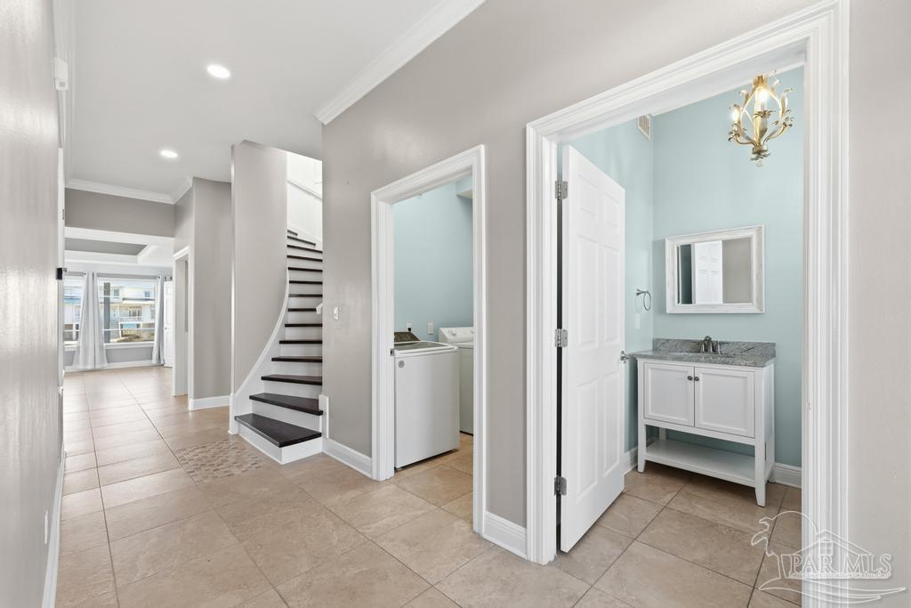 321 Gulfview Lane Perdido Key, FL 32507 - Photo 13 of 57 a view of a hallway with entryway and chandelier