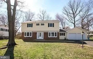 a house that has tree in front of it