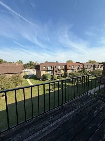 a view of a balcony with city