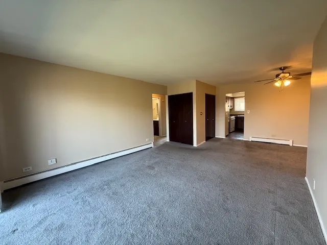 a view of an empty room and a window
