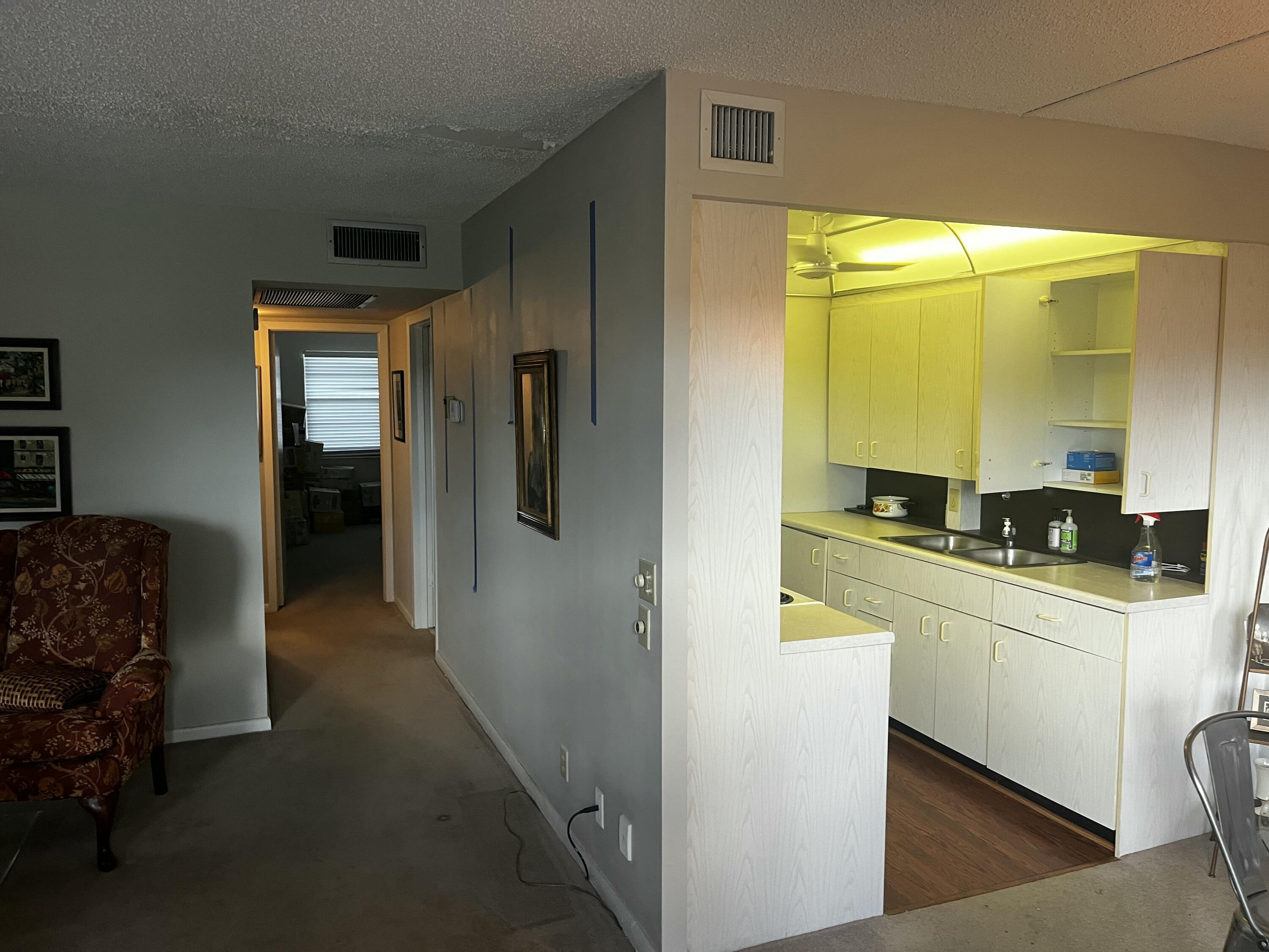 2087 Exeter Boca Raton, FL 33434 - Photo 2 of 3 a kitchen with stainless steel appliances a sink a refrigerator and cabinets