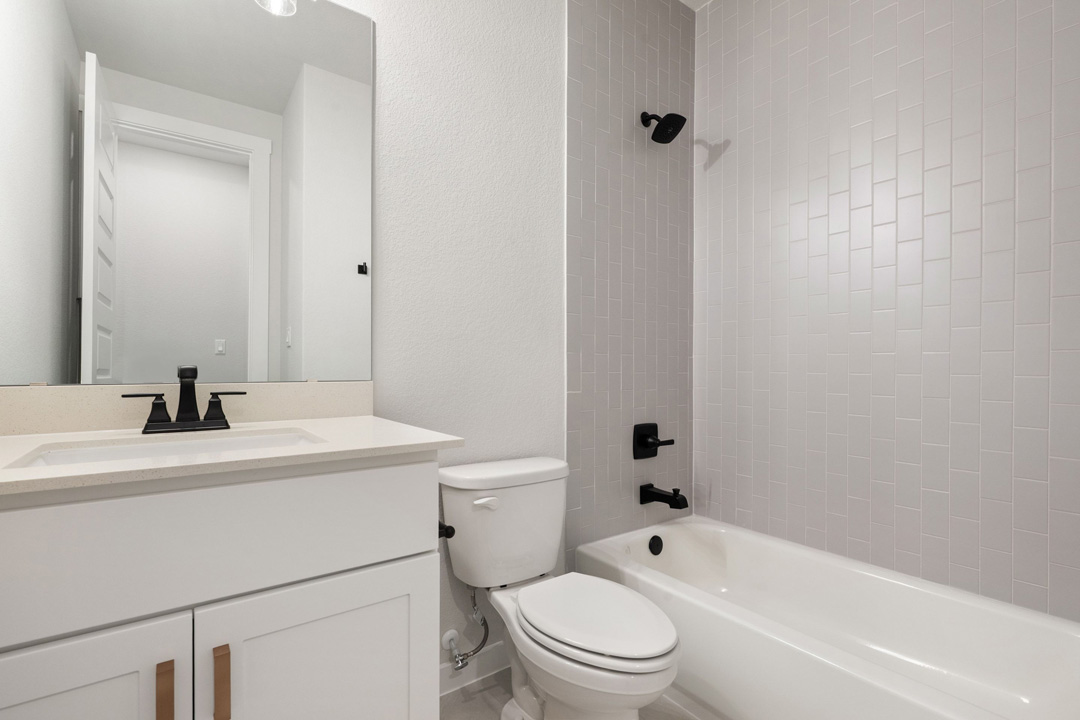 16201 Smithers Road Manor, TX 78653 - Photo 33 of 40 a bathroom with a sink a toilet and shower