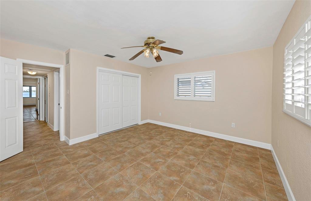1445 Corey Way South South Pasadena, FL 33707 - Photo 35 of 61 wooden floor in an empty room with a window