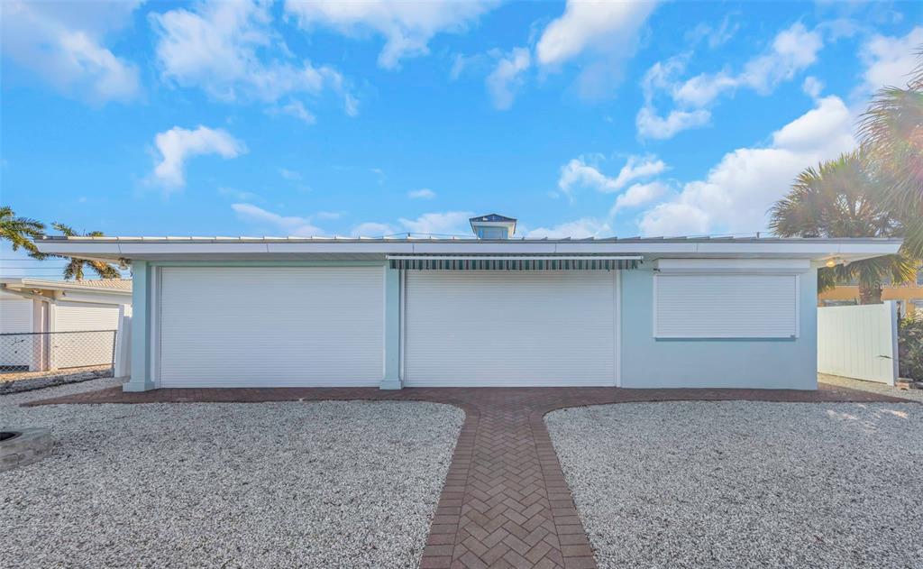 1445 Corey Way South South Pasadena, FL 33707 - Photo 50 of 61 a view of a house with a yard