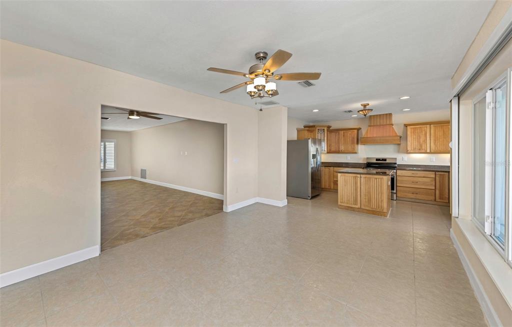 1445 Corey Way South South Pasadena, FL 33707 - Photo 9 of 61 a view of a kitchen with a sink and a refrigerator