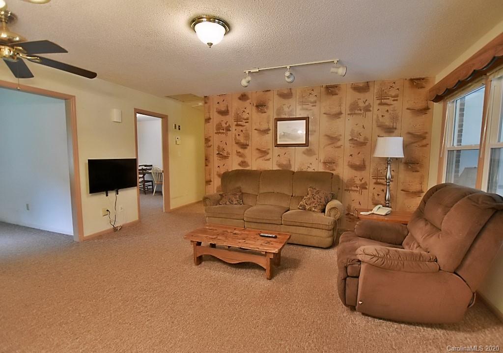8940 Collins Road Indian Land, SC 29707 - Photo 8 of 28 a living room with furniture and a flat screen tv