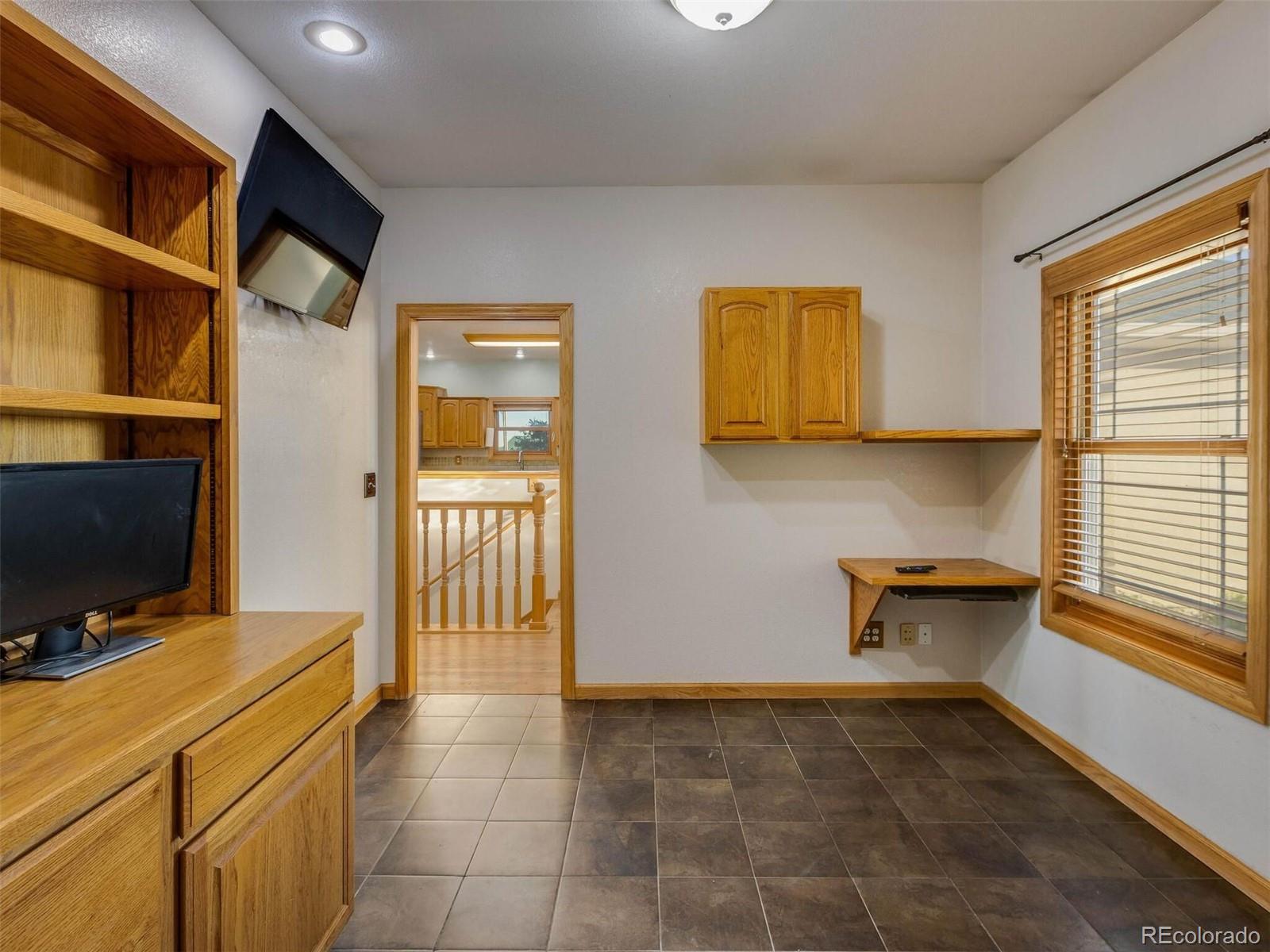 11200 County Road Wiggins, CO 80654 - Photo 18 of 40 a view of hallway with livingroom and furniture