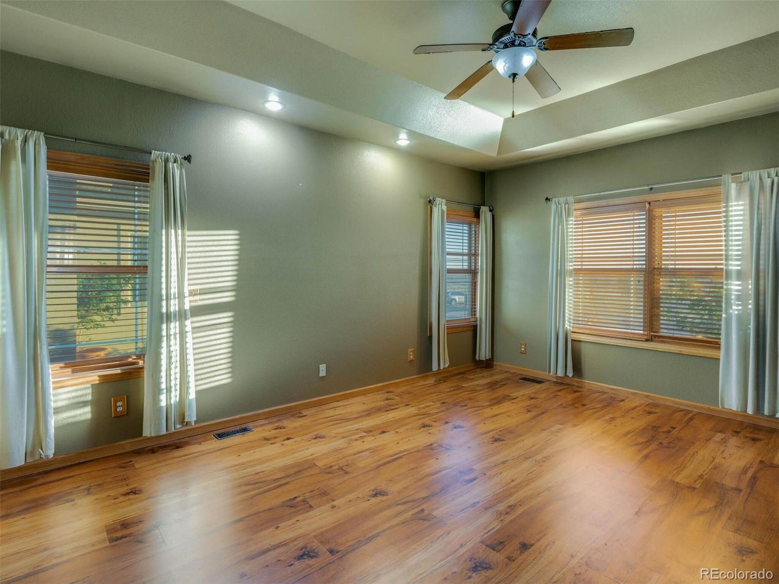11200 County Road Wiggins, CO 80654 - Photo 20 of 40 a view of an empty room with a window and wooden floor