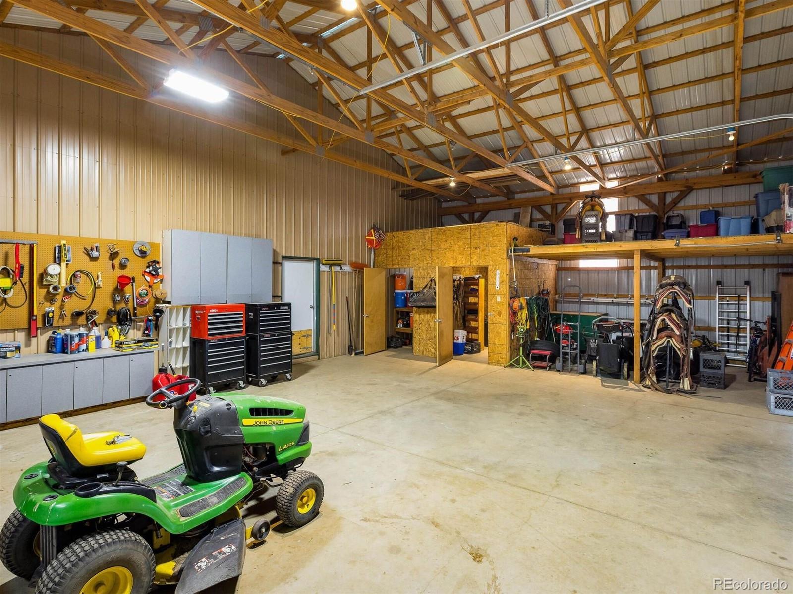 11200 County Road Wiggins, CO 80654 - Photo 8 of 40 a garage with furniture