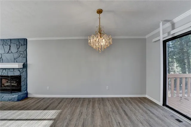 a kitchen with stainless steel appliances a refrigerator sink and cabinets