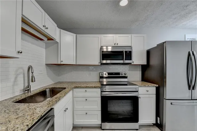 a view of storage and utility room with washer and dryer