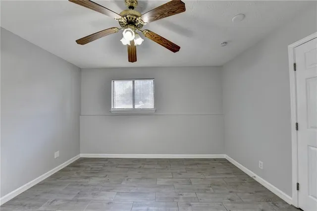 a view of a house with a yard and a deck