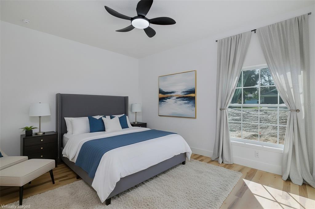 11277 Fool Duck Avenue Weeki Wachee, FL 34613 - Photo 17 of 75 a bedroom with a bed and a window