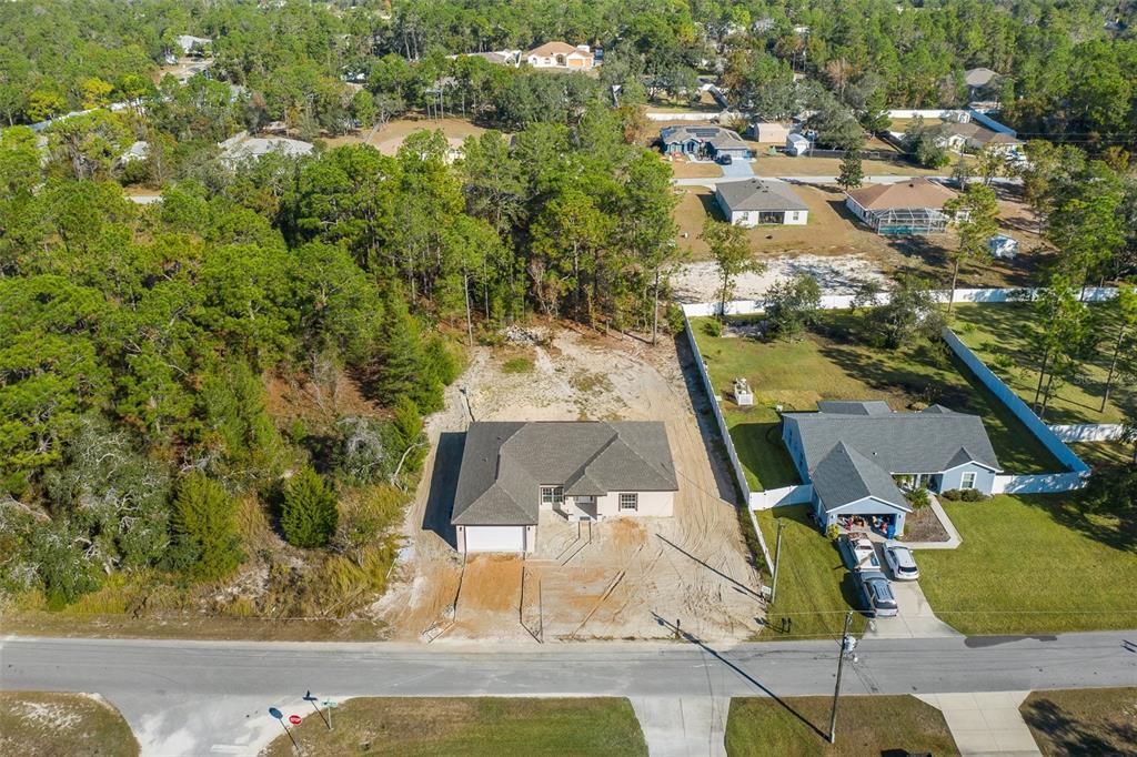 11277 Fool Duck Avenue Weeki Wachee, FL 34613 - Photo 26 of 75 an aerial view of residential houses with outdoor space