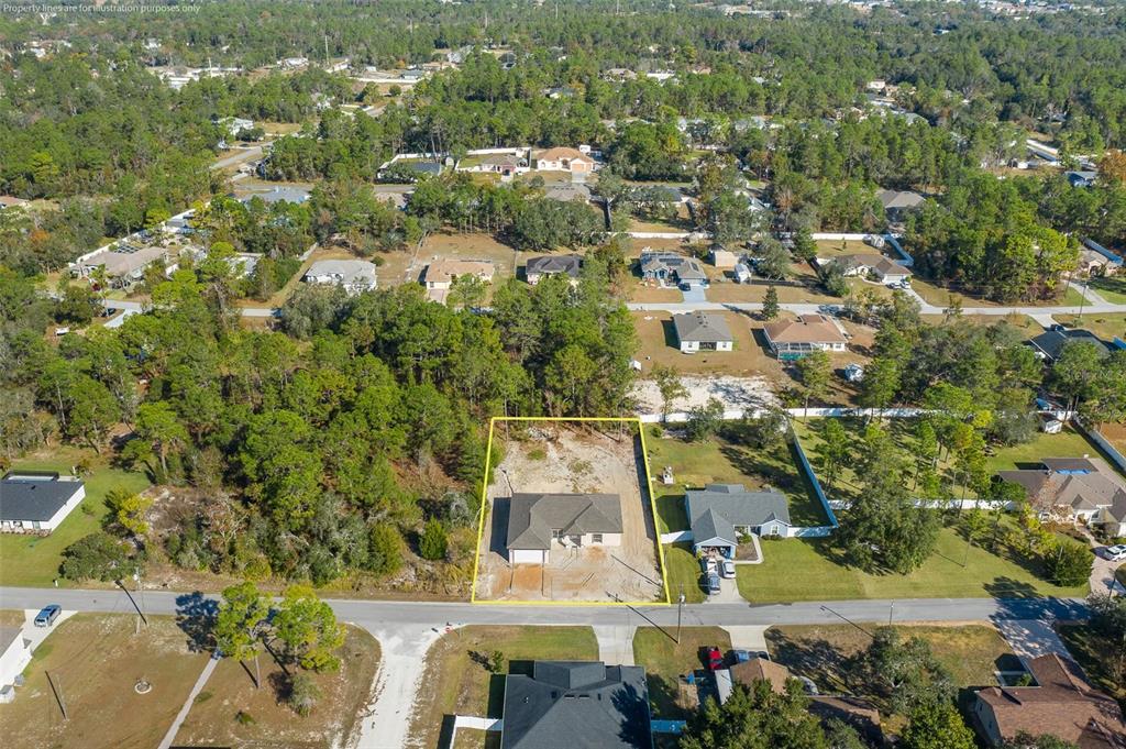 11277 Fool Duck Avenue Weeki Wachee, FL 34613 - Photo 27 of 75 an aerial view of residential houses with outdoor space