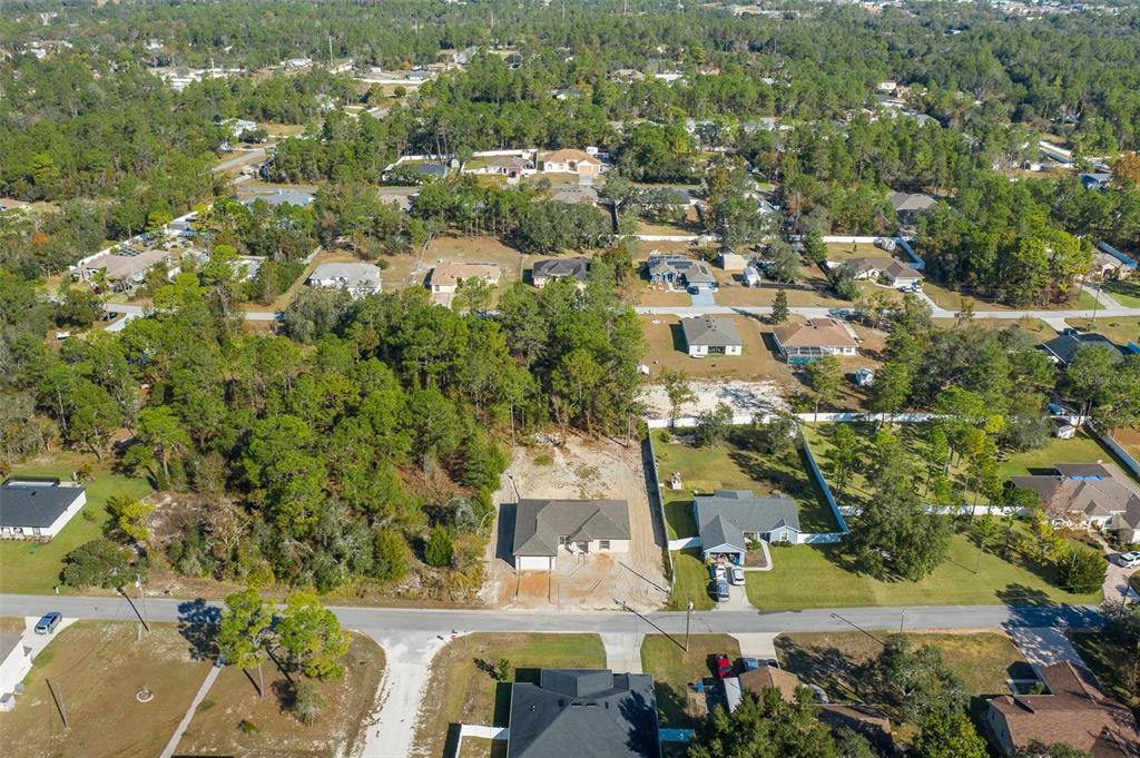 11277 Fool Duck Avenue Weeki Wachee, FL 34613 - Photo 28 of 75 an aerial view of residential houses with outdoor space
