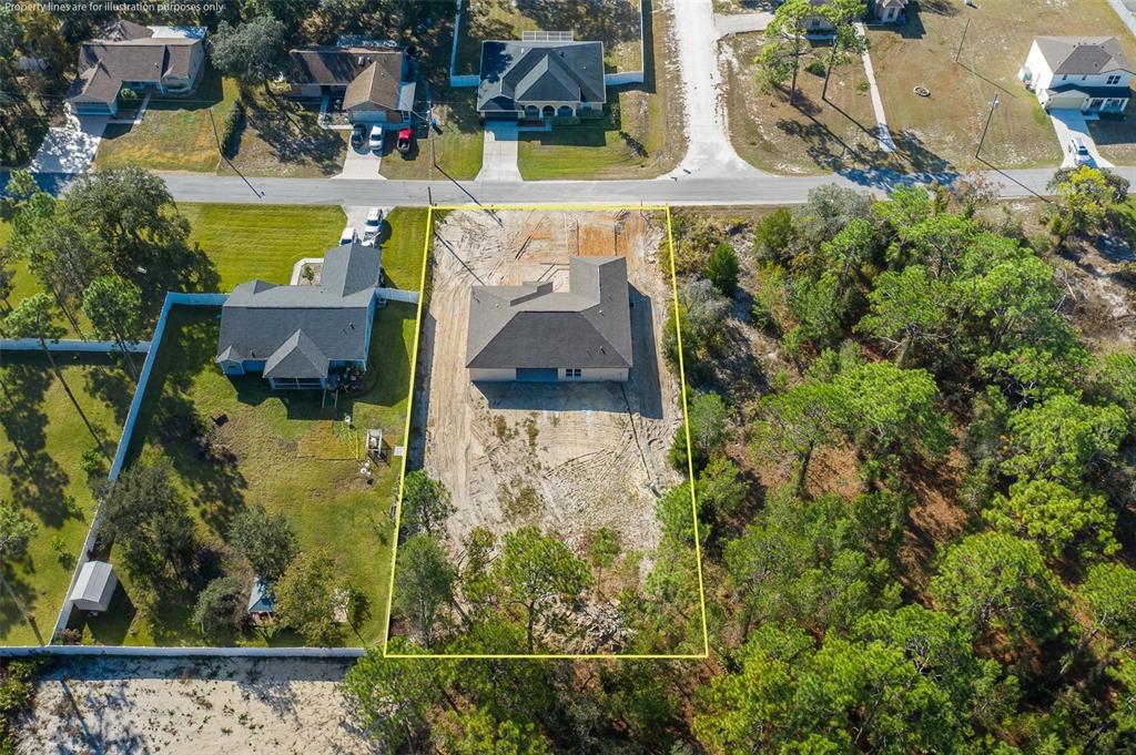 11277 Fool Duck Avenue Weeki Wachee, FL 34613 - Photo 33 of 75 an aerial view of a house with a yard