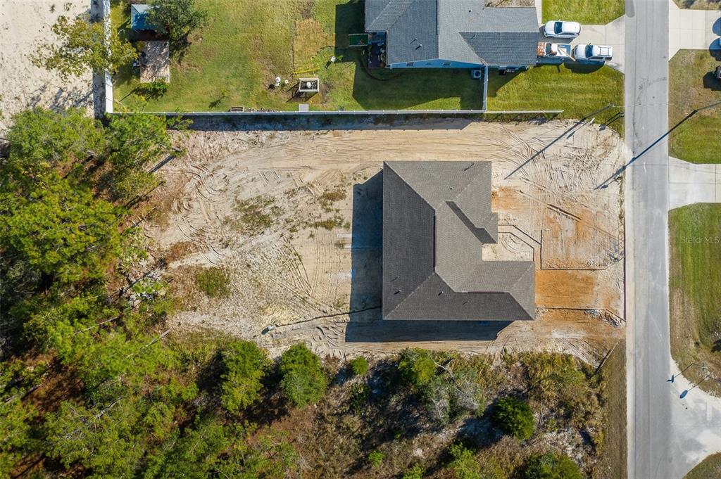 11277 Fool Duck Avenue Weeki Wachee, FL 34613 - Photo 36 of 75 an aerial view of a house with a yard