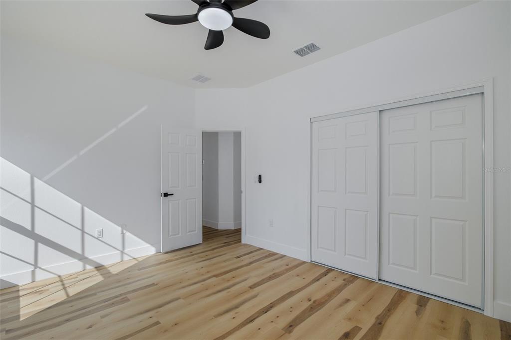 11277 Fool Duck Avenue Weeki Wachee, FL 34613 - Photo 45 of 75 a view of empty room with wooden floor