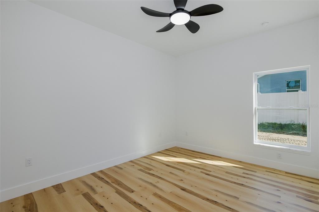 11277 Fool Duck Avenue Weeki Wachee, FL 34613 - Photo 49 of 75 a view of a room with wooden floor and window