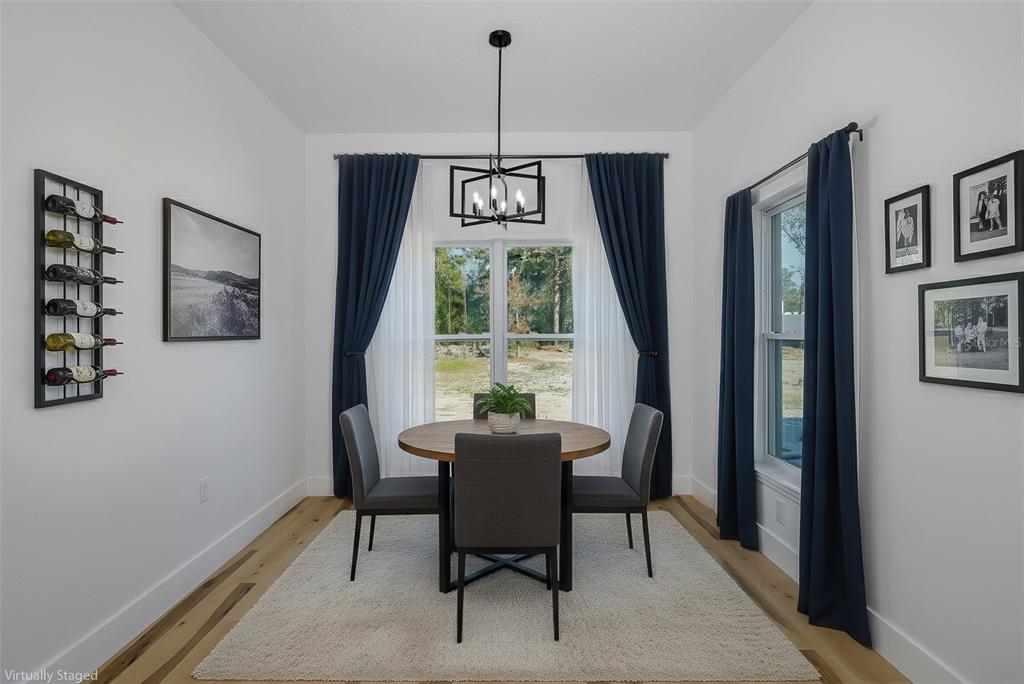 11277 Fool Duck Avenue Weeki Wachee, FL 34613 - Photo 8 of 75 a dining room with furniture and window