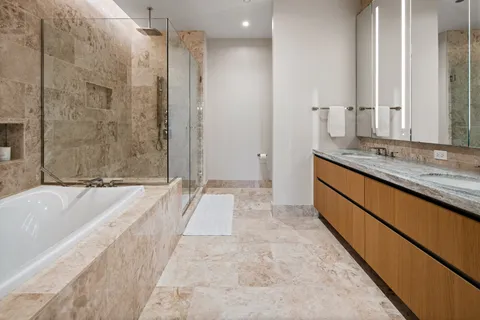 a bathroom with a bathtub and a shower