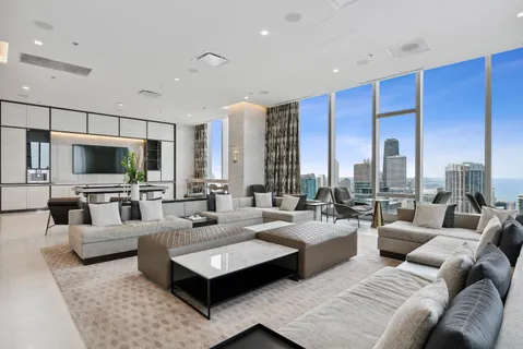 a lobby with furniture and large window