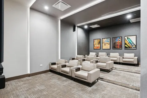 a living room with furniture and a floor to ceiling window