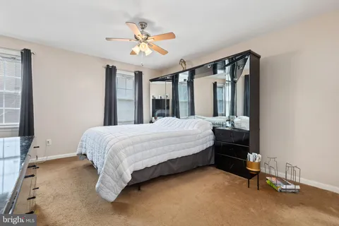 a bed room with a bed and a chandelier