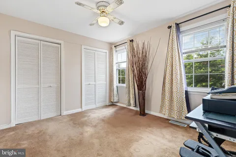 a view of a livingroom with furniture and a window