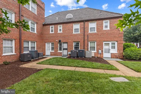 a front view of a house with a yard and porch