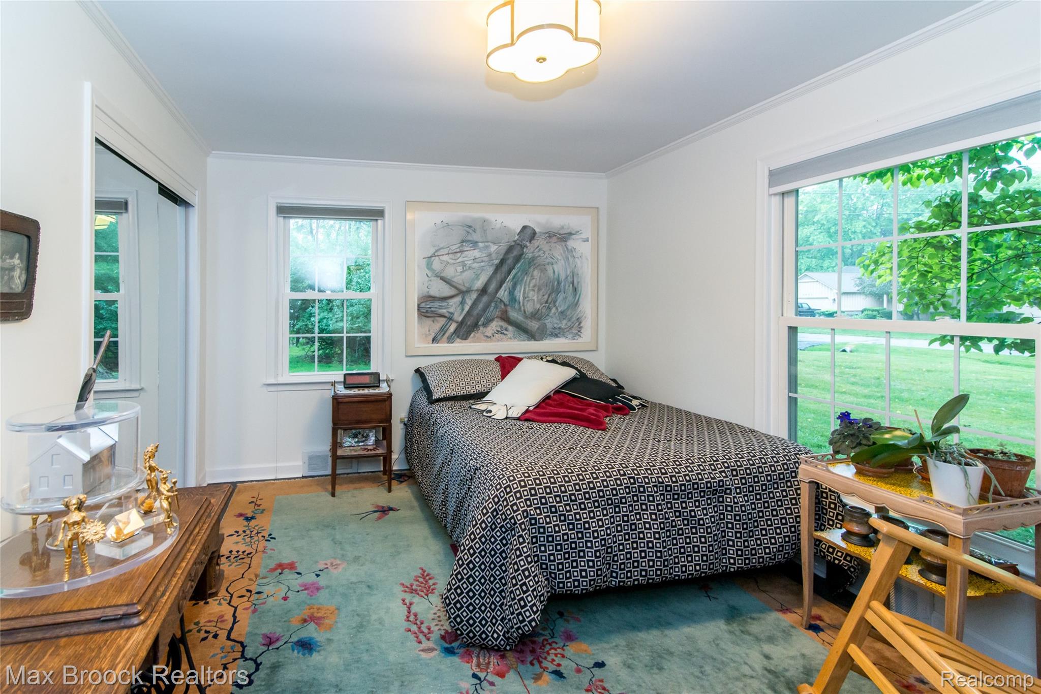 6799 East Dartmoor Road West Bloomfield, MI 48322 - Photo 21 of 36 Room with light wood-finish flooring, white walls, and a decorative area rug