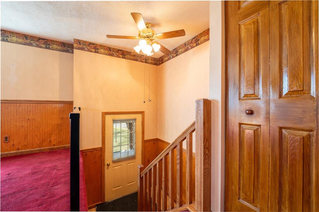 599 Laurel Summit Road Boswell, PA 15531 - Photo 6 of 35 a view of a hallway with wooden floor and staircase