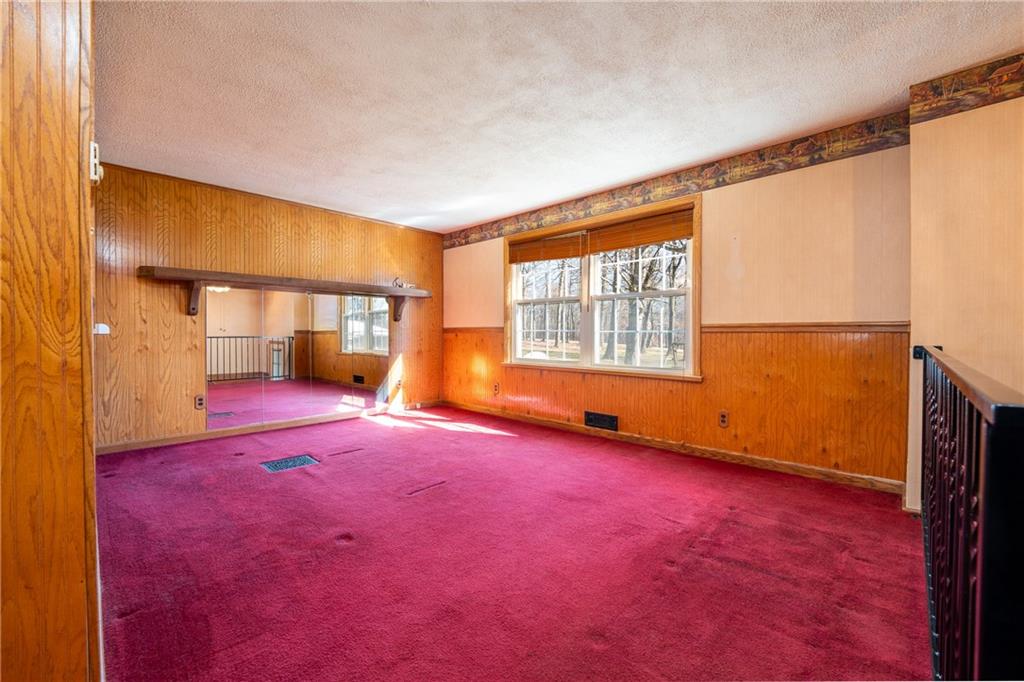 599 Laurel Summit Road Boswell, PA 15531 - Photo 7 of 35 an empty room with a fireplace and window