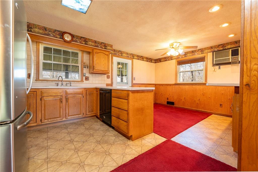 599 Laurel Summit Road Boswell, PA 15531 - Photo 9 of 35 a kitchen with stainless steel appliances granite countertop a sink and cabinets
