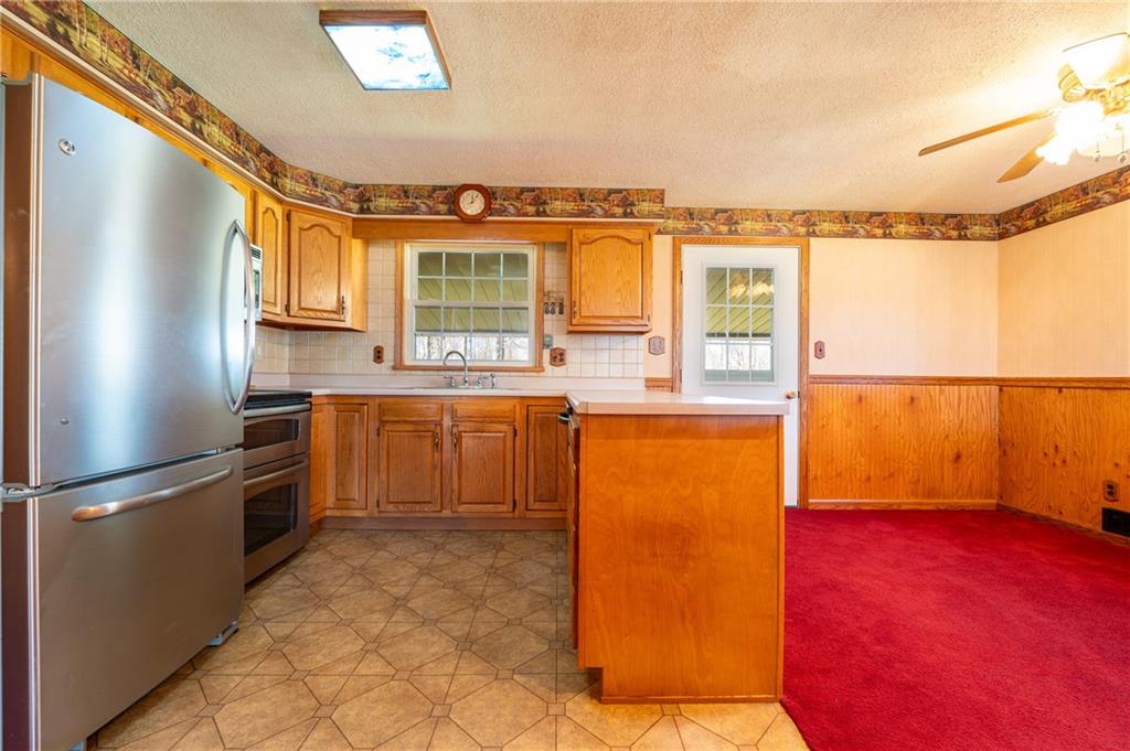 599 Laurel Summit Road Boswell, PA 15531 - Photo 10 of 35 a kitchen with stainless steel appliances granite countertop a refrigerator and a sink