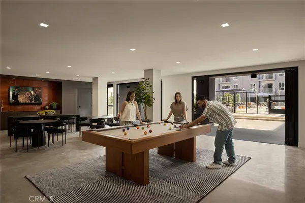 a kitchen with a dining table and chairs